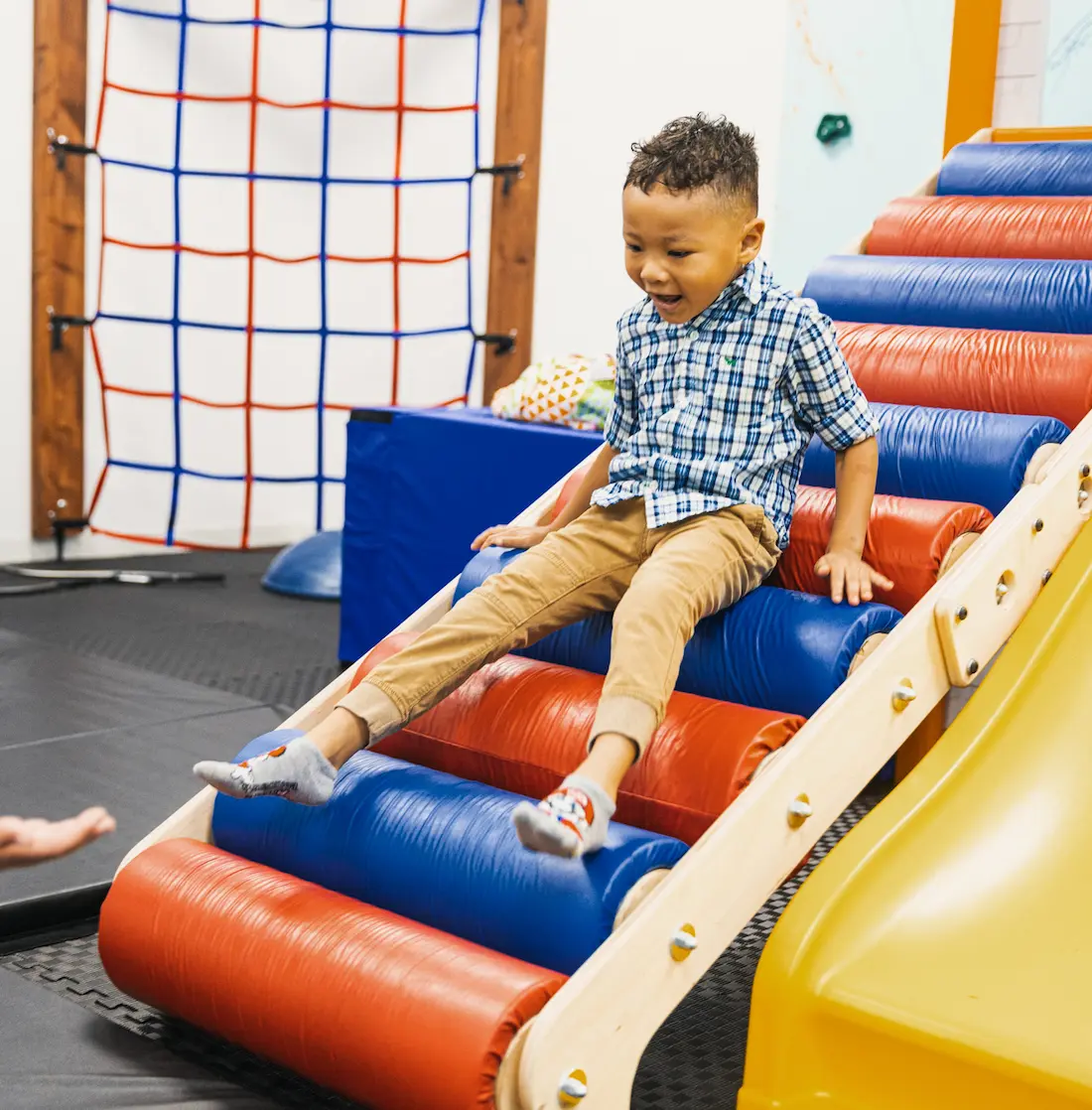 boy-going-down-roller-slide