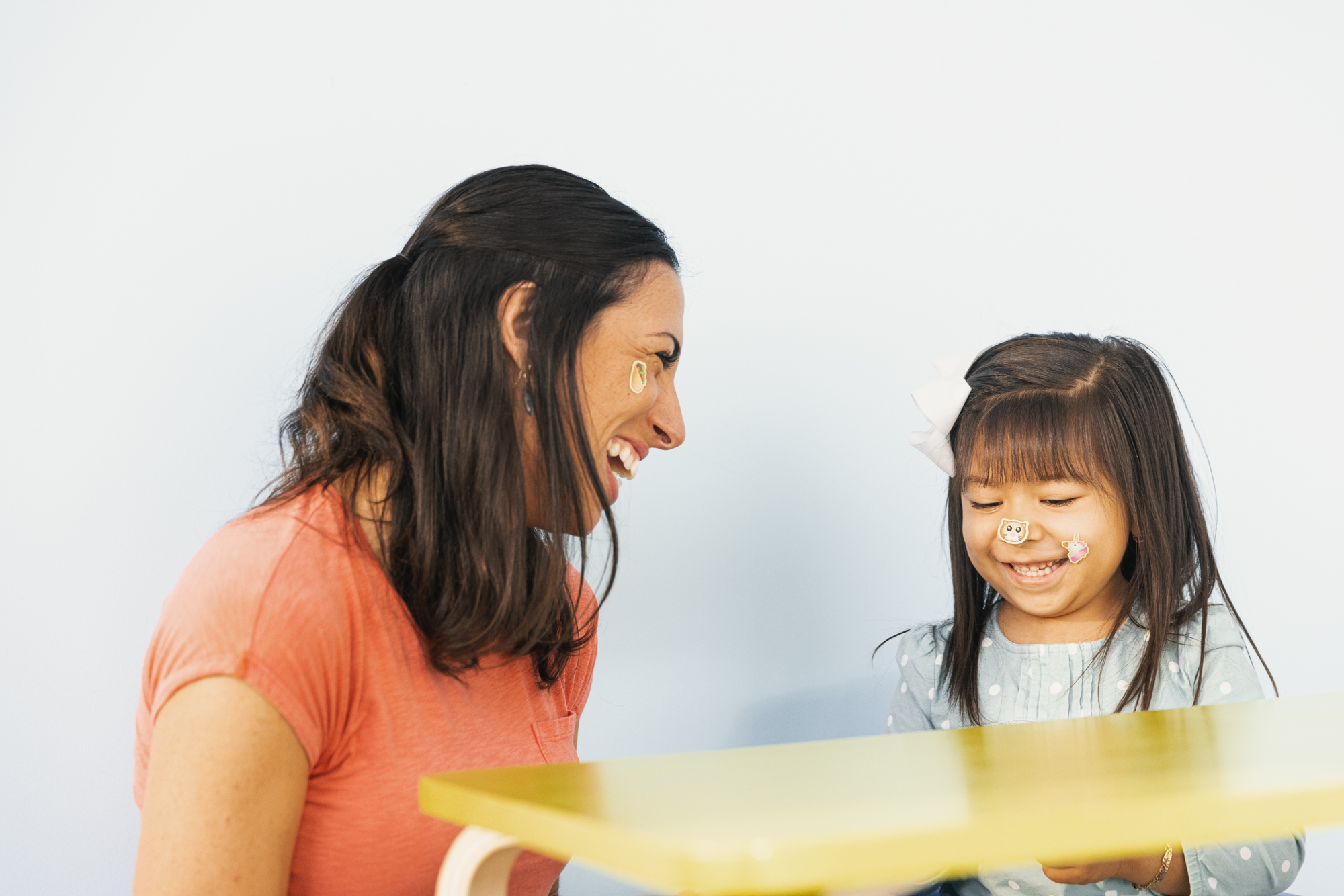 Therapist and Child Laughing w Stickers